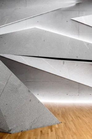 concert hall with splinter-shaped granite elements on wall and ceiling