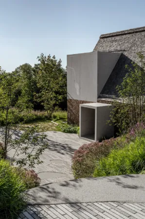 house with solid granite cube stone strip paving and granite entrance portal
