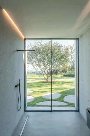 granite shower with view into the garden
