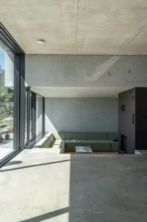 modern living room with concrete look and solid granite ceiling element