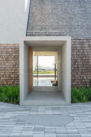 entrance portal milled from a single raw block with open door