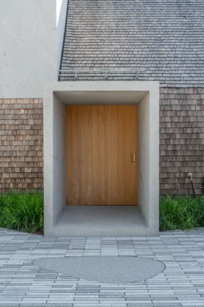 entrance portal milled from a single raw block with closed door