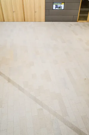 reddish-yellow flooring with milled-in guiding lines
