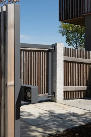 Pillar of a garden fence made from solid granite