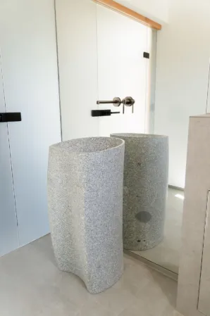 Wash basin made from solid light-colored granite