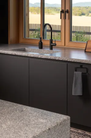 Kitchen with a counterop made from solid granite