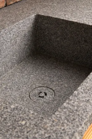 Detail shot of a wash basin made from solid granite