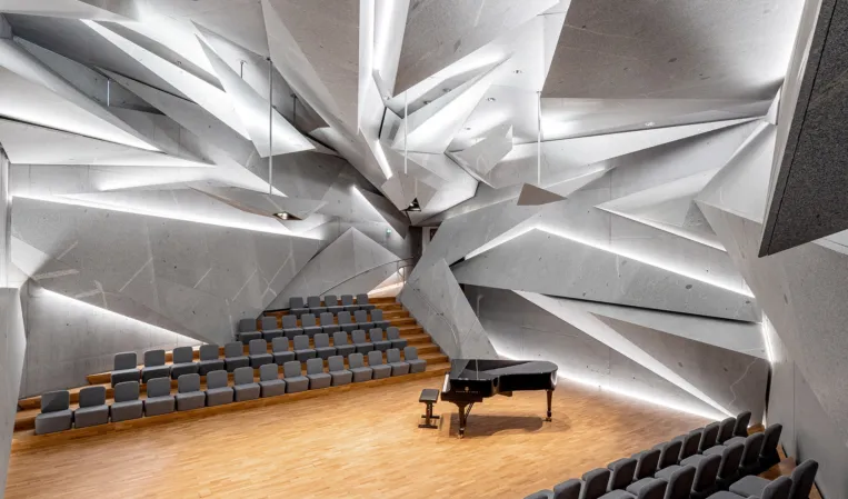 concert hall with splinter-shaped granite elements on wall and ceiling