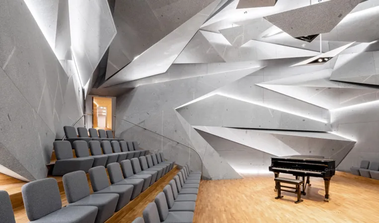 concert hall clad with splinter-shaped granite slabs