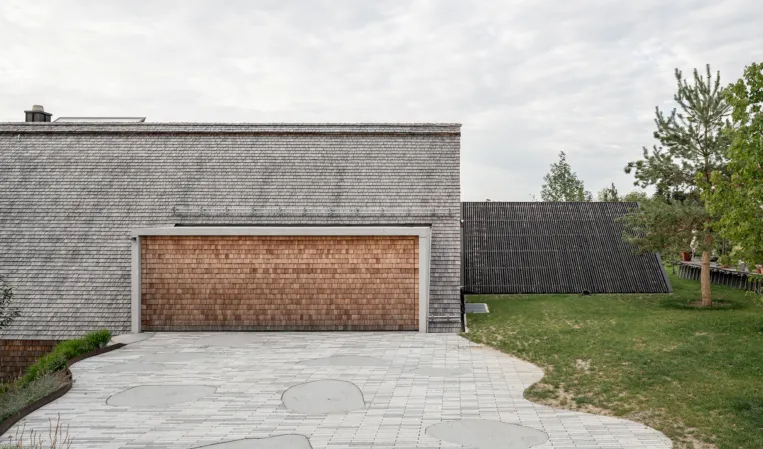 granite garage integrated into the roof gable