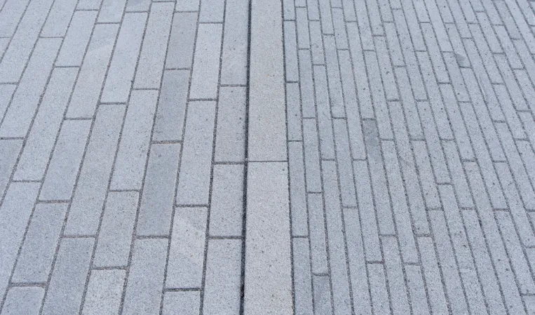 transition from stone strip paving to standard paving