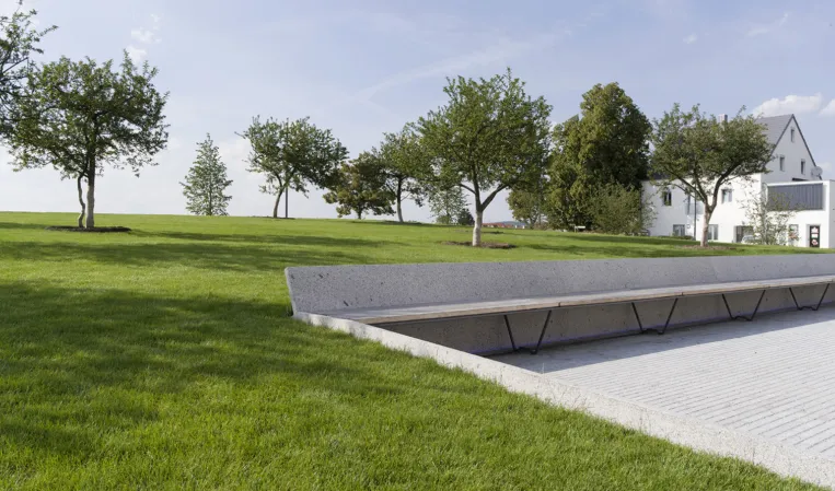 park with granite bench integrated into the topography