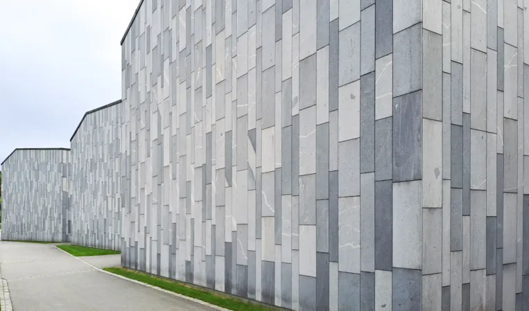 natural stone façade of three company buildings made from 3 different types of granite