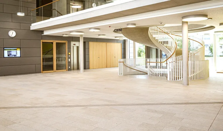 reddish-yellow natural stone flooring in an entrance hall