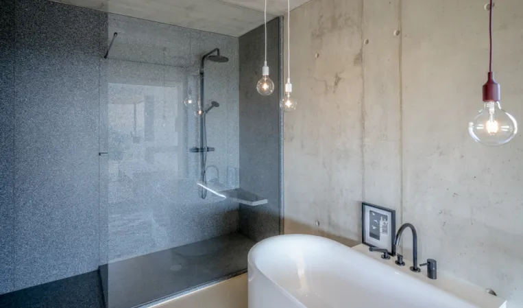 Bathroom made out of dark granite