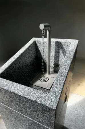 a rectangular shaped drinking fountain