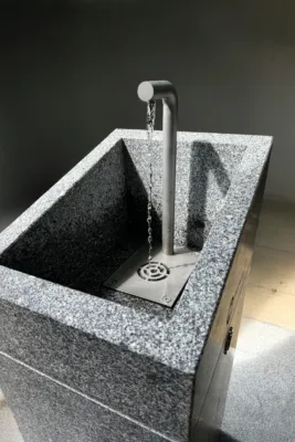 a rectangular shaped drinking fountain