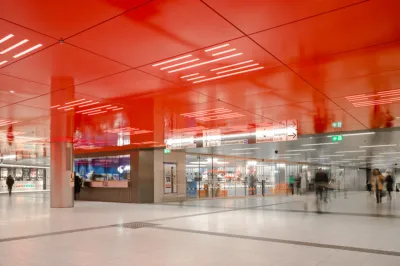 flooring of a underground station with a red ceiling