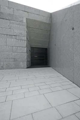 the entrance of a load-bearing granite building made out of solid granite blocks