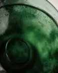 macro shot of a green glass bottle
