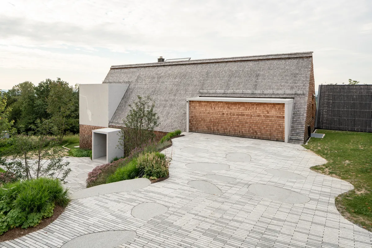 A modern architectural house made of stone and wood