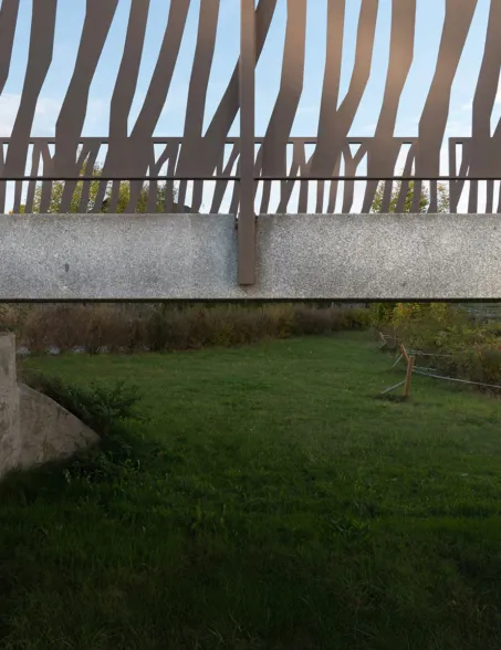 Close-up of the railing installation on a granite bridge